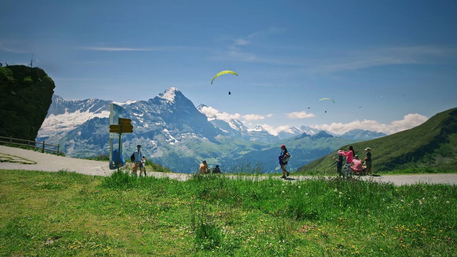 Families at an Alpine viewpoint below the Eiger in Switzerland.