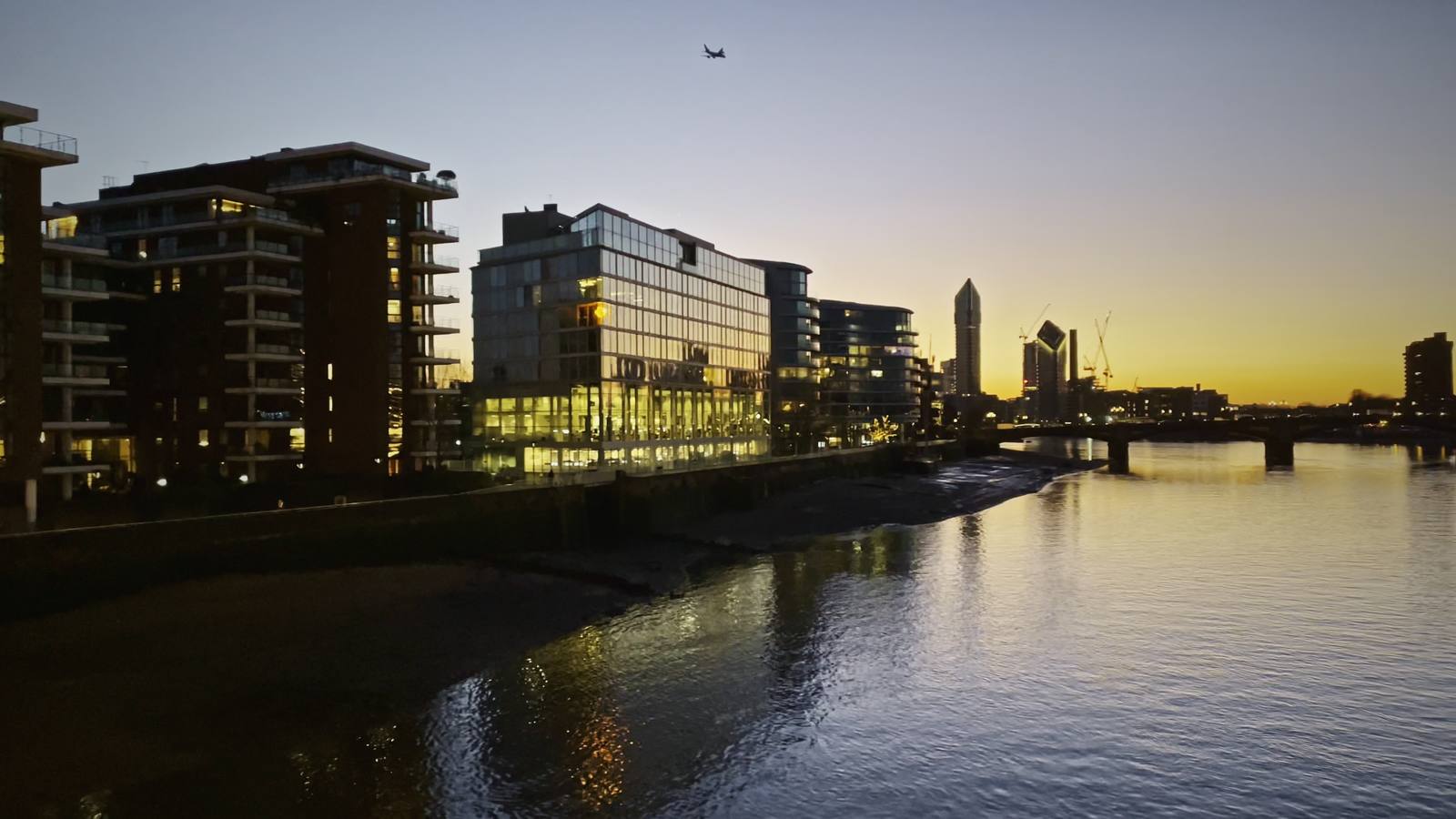 The Thames at golden sunset, seen from a London bridge.